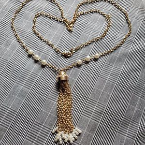 Enticing golden curb chain necklace w/ tassel